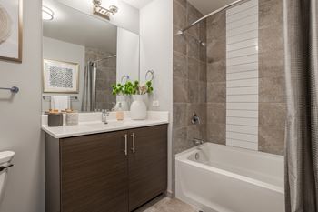 Bathroom with a sink and a shower and a bath tub